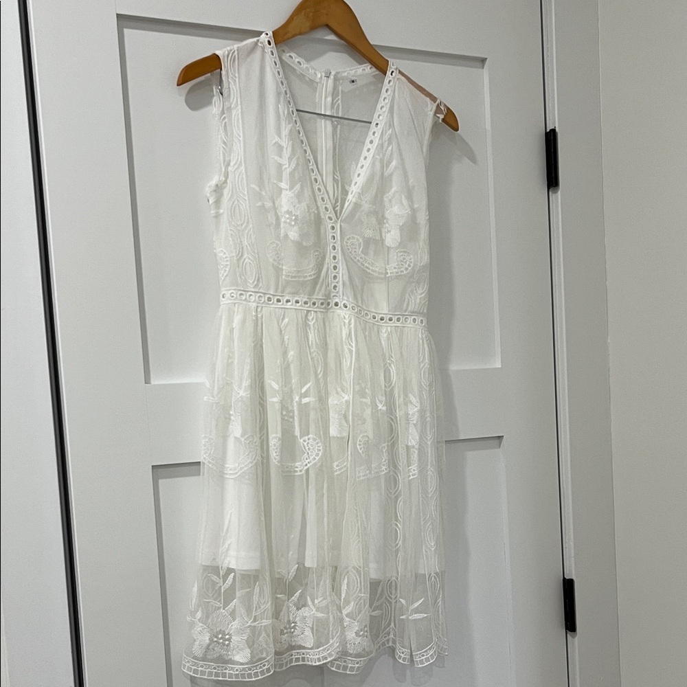 White dress size M.  Excellent condition. Beautiful lace overlay